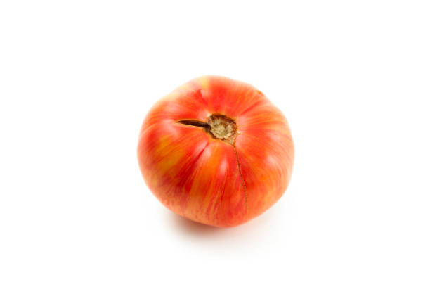 Whole ripe juicy pink tomato with soft shadow isolated on white background with clipping path. Vegetables collection on white.