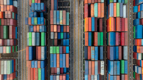 istock cargo containers top down aerial view. Containers at logistics terminal center. Cargo container outdoor warehouse 2153950780