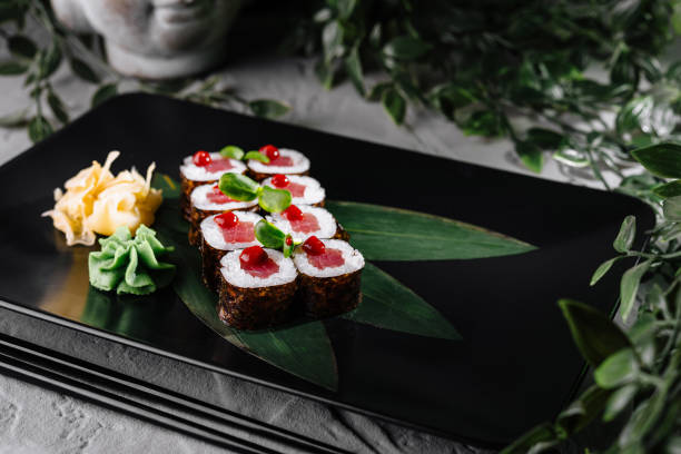 istock Gourmet tuna sushi rolls on elegant black plate 2153950840