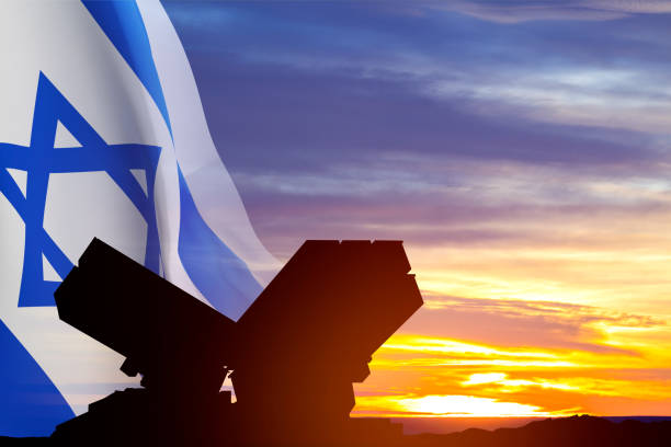 Israel Air Defence concept. Silhouette of Air defence system with Israel flag against the sunset