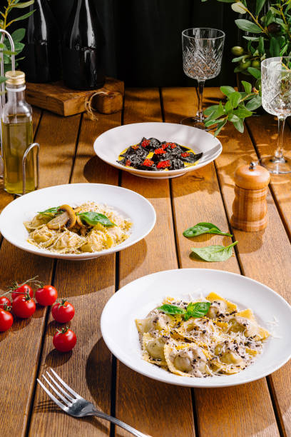 istock Gourmet italian pasta dishes on rustic wooden table 2153951450
