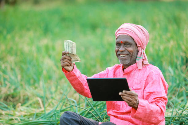istock Indian farm worker holding tablet 2153952025