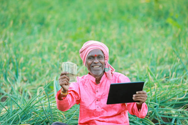 istock Indian farm worker holding tablet 2153952047