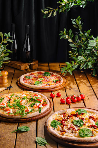 istock Gourmet italian pizzas on rustic wooden table 2153953564