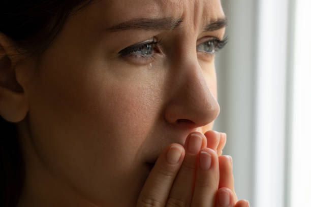 Young crying woman eyes with a tears