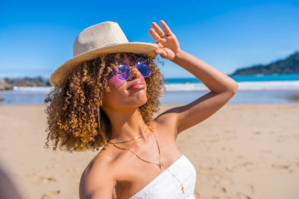 istock Beauty woman grimacing while taking selfie on the beach 2153960552