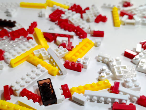 Toy colorful plastic blocks on white isolated background