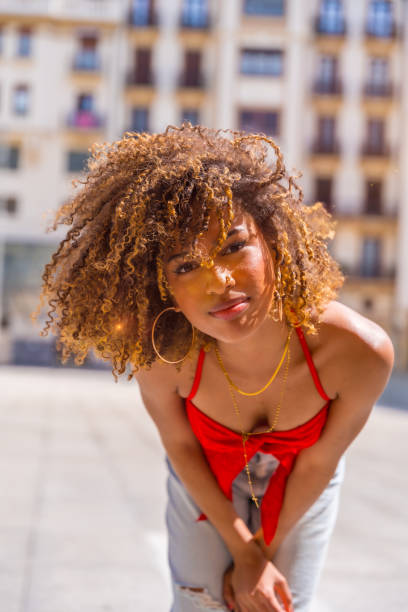 istock Brunette model posing looking at camera in the city 2153964353