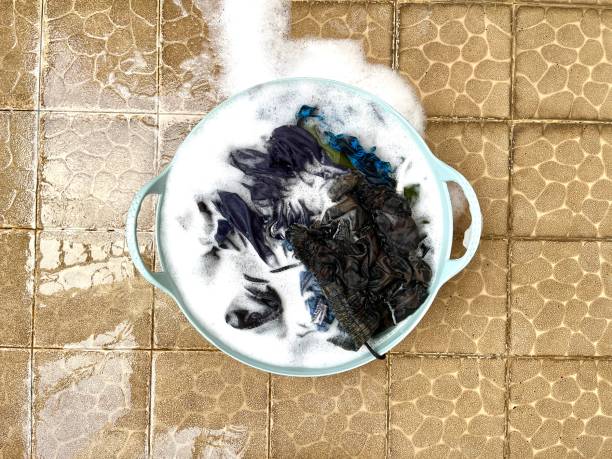 istock Laundry clothes in detergent soap foam 2153964390