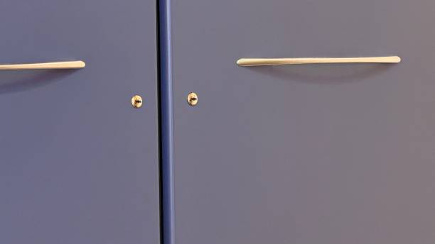 istock Cabinet handles, closed, blue colored cabinet 2153967952