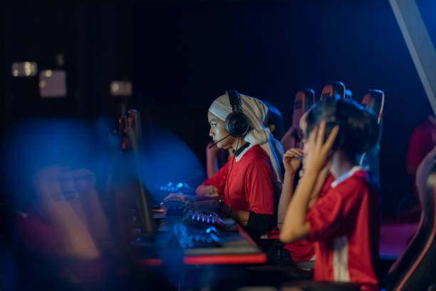 istock Asian female malay gamer with team members 2153968611