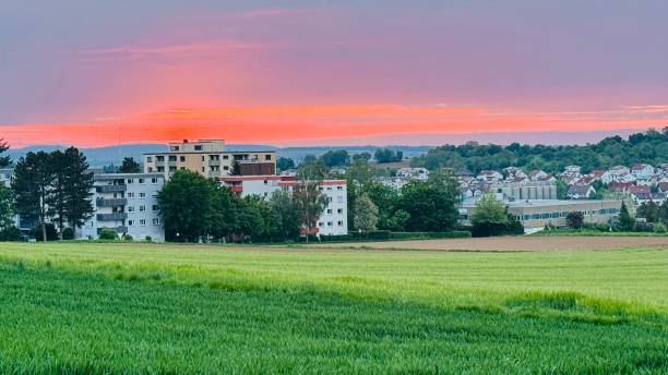 Sunset over the suburbs at agricultural fields