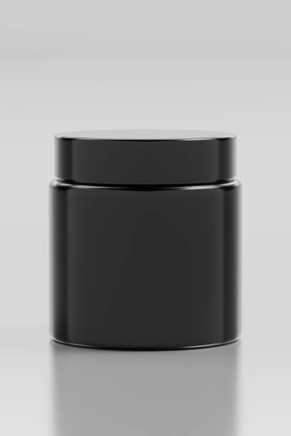 istock Matte black cosmetic jar sits against a neutral background, highlighting its minimalist design. 3d render 2153972572