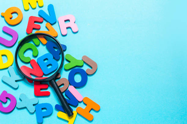 istock Magnifier placed on English letters 2153973424