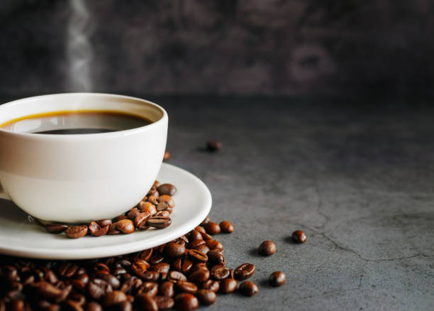 istock Coffee cup and coffee beans on  gray background, Black coffee cup aromatic,Close up 2153973950