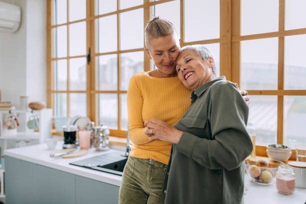 istock Senior mother and daughter bonding in a domestic kitchen 2153974829