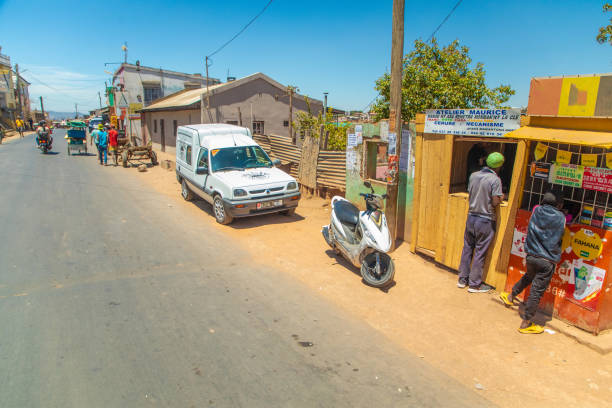 Antananarivo, Madagascar. 07 oktober 2023. street of Antananarivo. People suffer of poverty slow development country. townspeople rushing about their business. Vendors selling street food and fruits