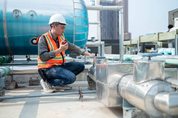 istock Industrial Engineer Communicating via Walkie-Talkie on Site 2153985402