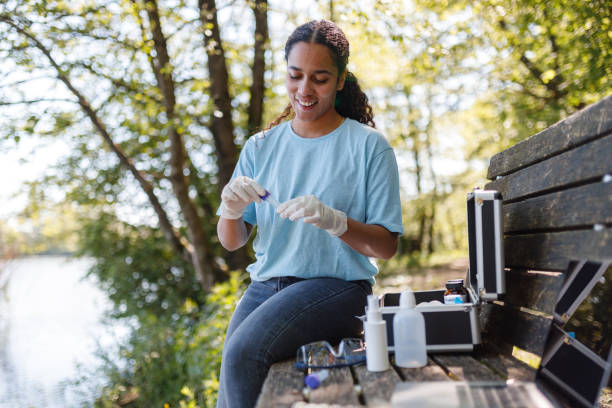 istock Young Woman Conducts Environmental Testing Outdoors 2153986907