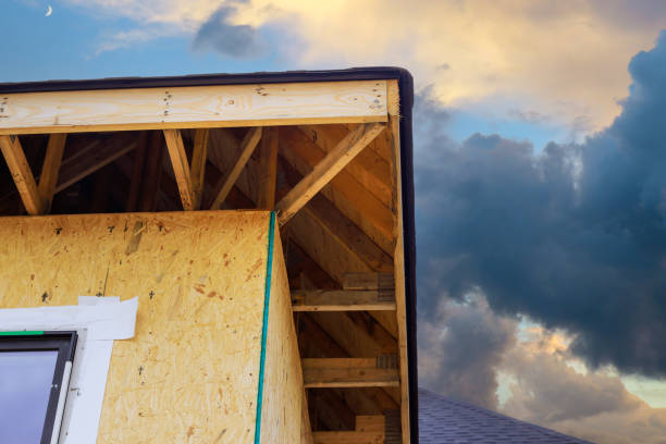 istock During construction of house, joist framework featuring plywood is installed, gutter holders are installed, a soffit fascia trim installed 2153988491
