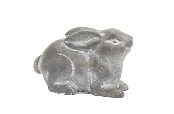 istock cute cement rabbit statue for decorate isolated on white background 2153989217