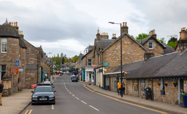 Pitlochry, Perthshire, Scotland, UK- 5/9/2024: The main street in Pitlochry, a small touristic town in Highland Perthshire, with locals and tourists walking.