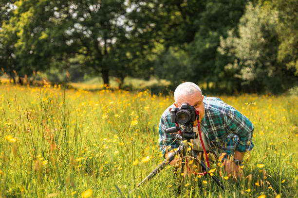 istock Happy photographer at work in nature 2153993302