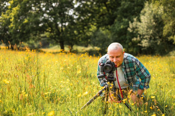 istock Happy photographer at work in nature 2153993313