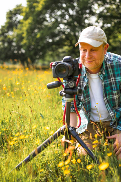 istock Happy photographer at work in nature 2153993399