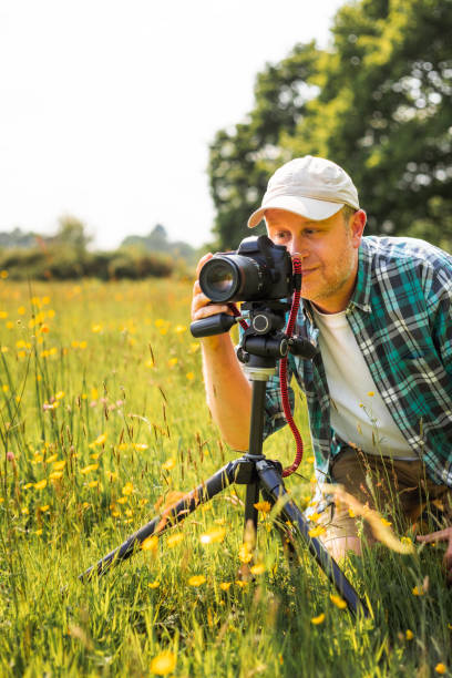 istock Happy photographer at work in nature 2153993410