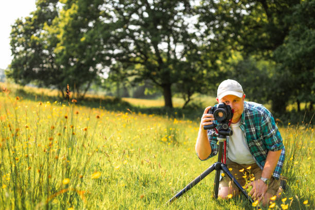 istock Happy photographer at work in nature 2153993528