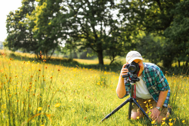 istock Happy photographer at work in nature 2153993533