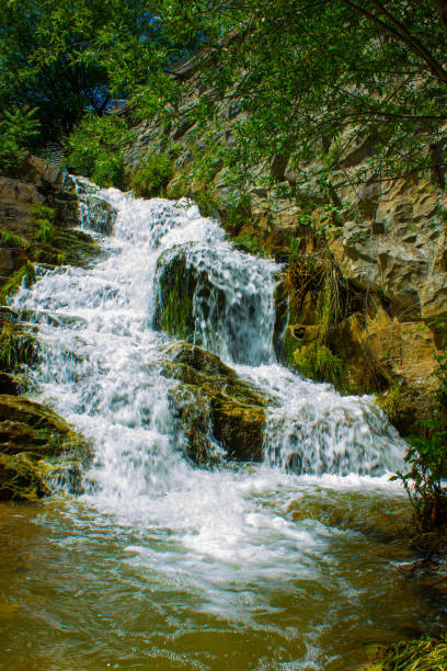 Cascata di Valclava or Kalmtaler Wasserfall waterfall in South Tirol, Italy during a beautiful springtime day in the Alps. The river Kalmbach is falling down in the midst of a dense forest