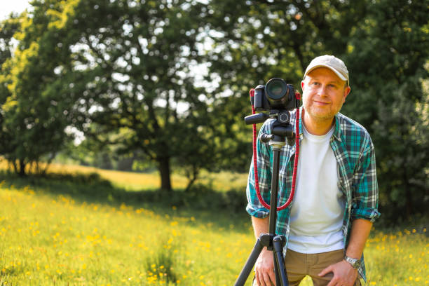 istock Happy photographer at work in nature 2153993622