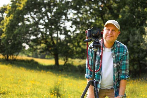 istock Happy photographer at work in nature 2153993623