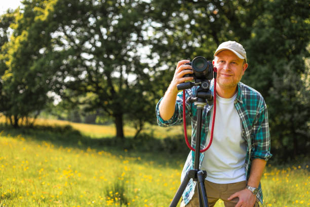 istock Happy photographer at work in nature 2153993633