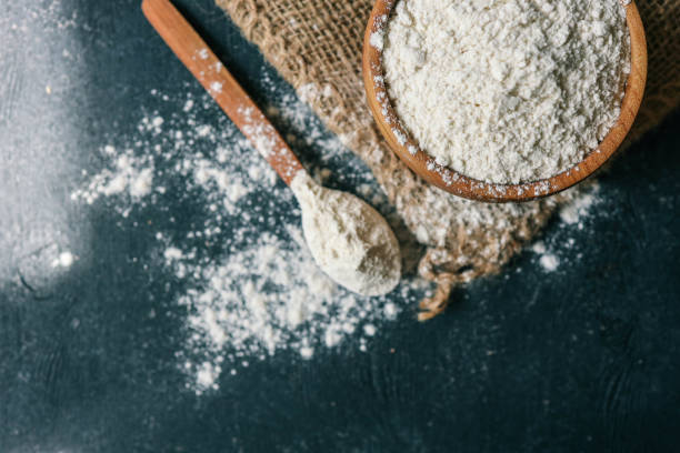 istock Flour in a wooden bowl on burlap 2153993930