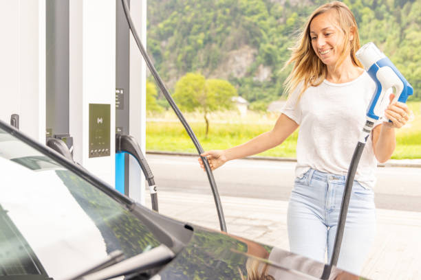 istock Charging Electric Vehicle at Station 2153994410