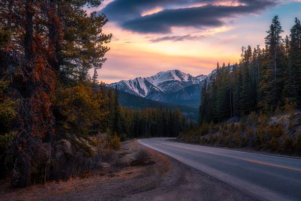 istock Sunrise Clouds Over A Banff Mountain Road 2153996707