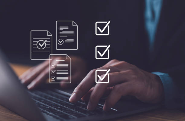 istock Checklist concept, Businessman mark checkboxes, Survey form, check marks on checklist, filling online form and answering questions. List options business employee security procedures followed office. 2153996883