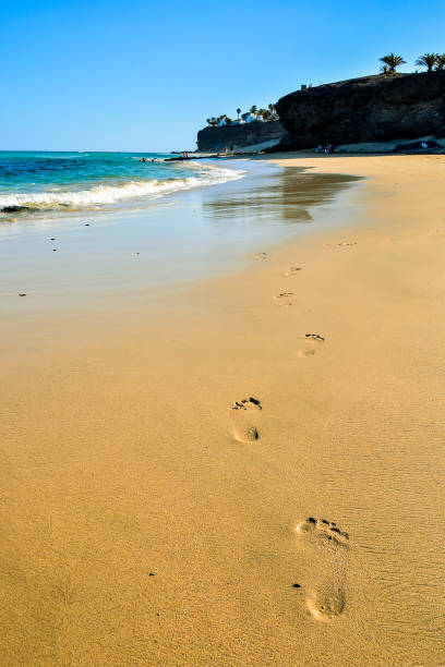 istock A beach with a cliff in the background 2154001305