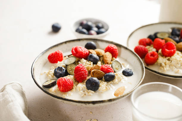 istock Two bowls of healthy oatmeal on table 2154003518