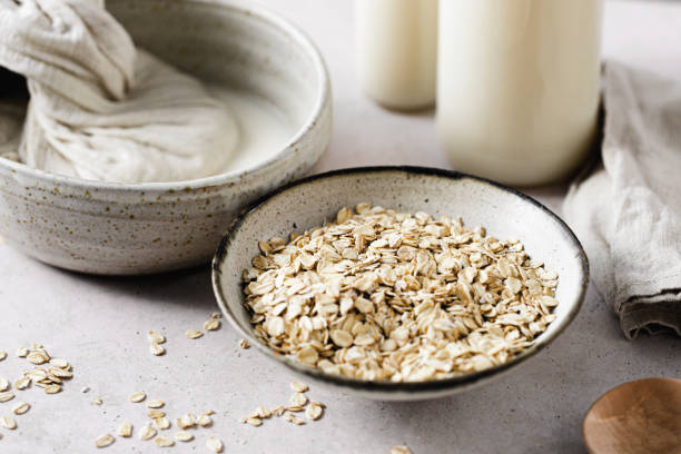 istock Preparing oat milk with strain cloth and oat flakes in kitchen 2154004601