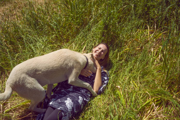 Young woman embracing the dog.