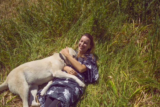Young woman embracing the dog.