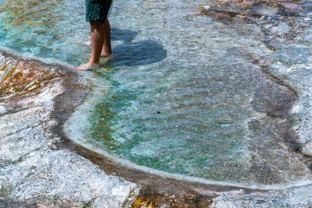Pamukkale Traventine a cross section. Tourists.