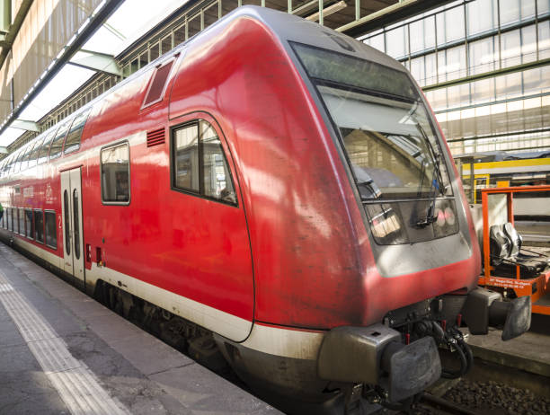 istock Modern high speed red commuter train at a railway station in Germany 2154008914