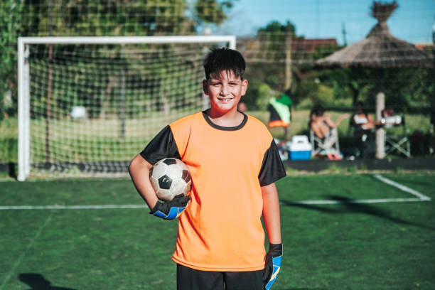 front view on soccer boy on soccer field
