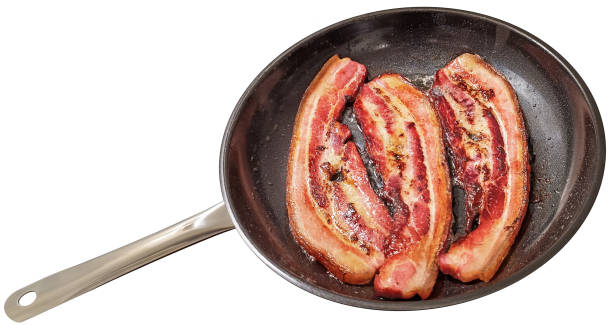 istock Freshly Fried Broiling Crispy Crunchy Gourmet Pork Belly Bacon Rashers In Large Ceramic Coated Frying Pan Isolated On White Background High Resolution Stock Image 2154011367