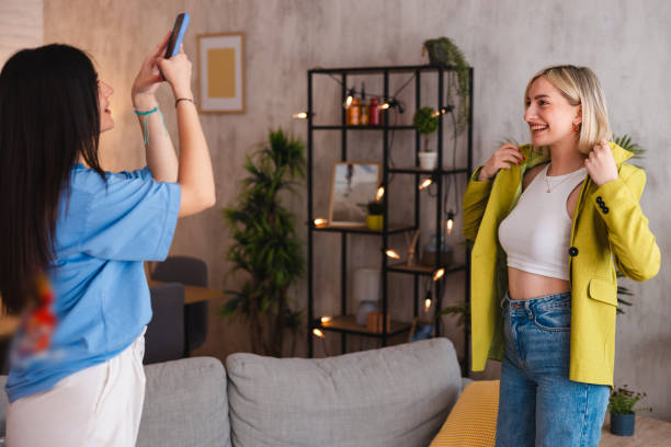 istock Two young women trying on the clothes they ordered online 2154012567
